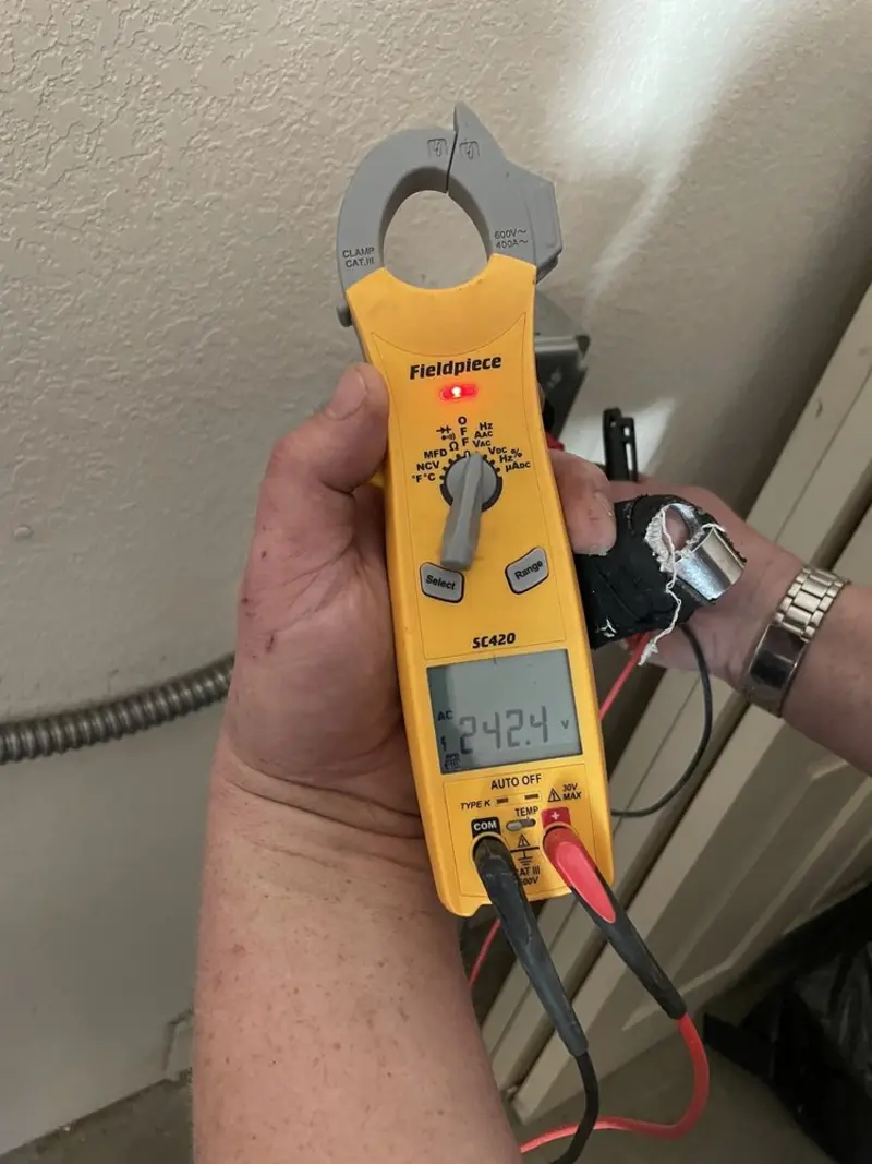 Voltage testing with clamp meter during Outlet Installation in Falmouth